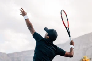 tennis athlete learning how to prevent shoulder injuries in overhead sports.