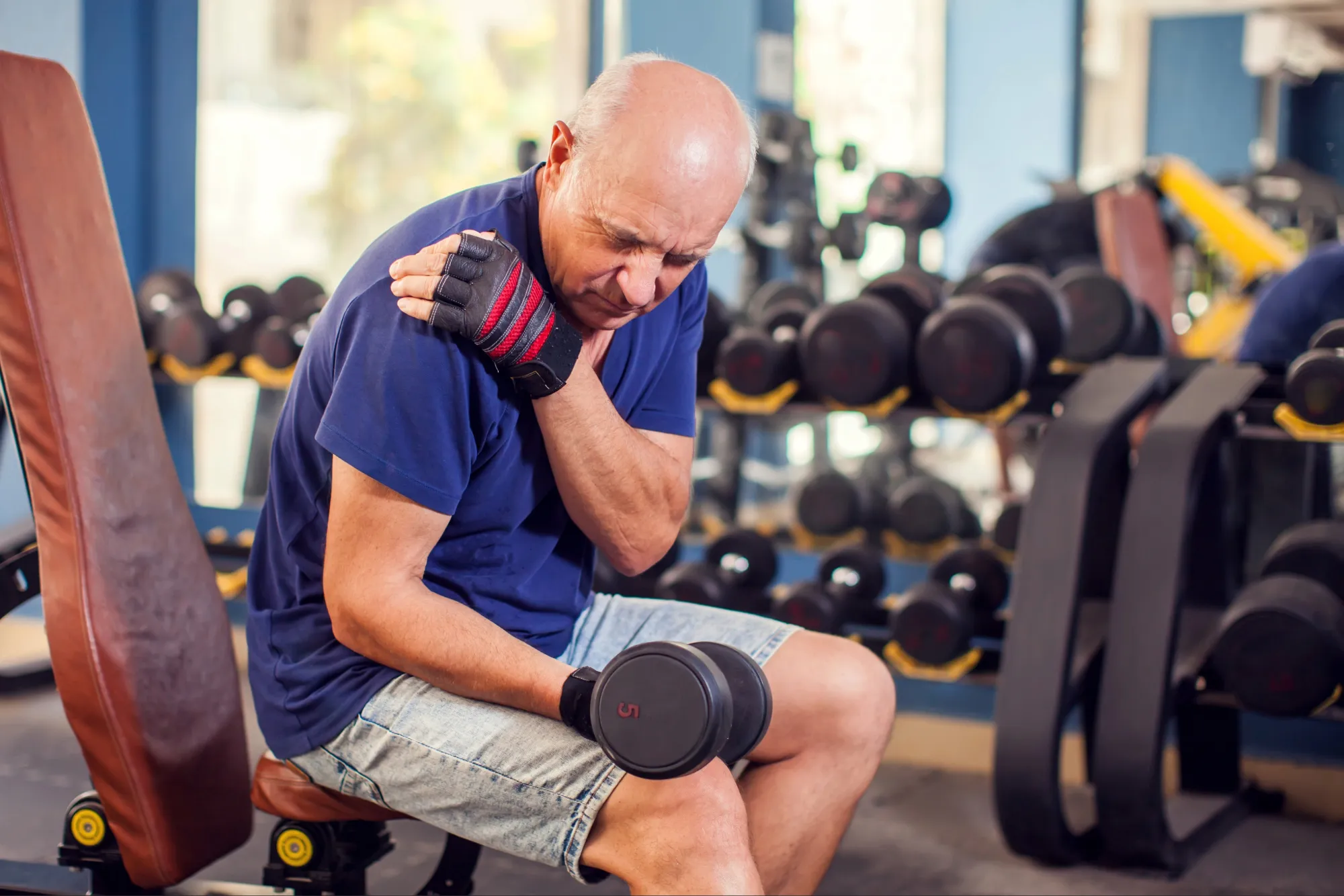 patient with shoulder pain from weightlifting at the gym.